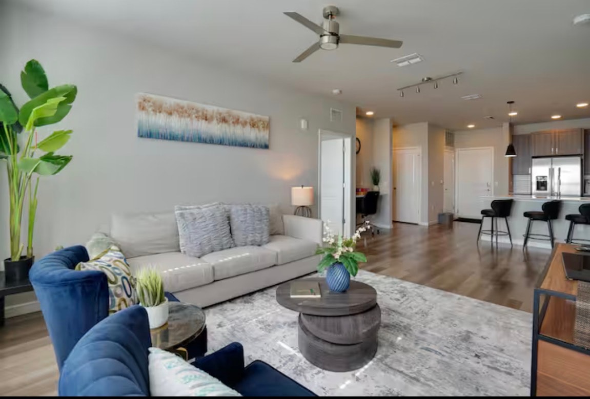 Open-concept living and kitchen area with hardwood floors