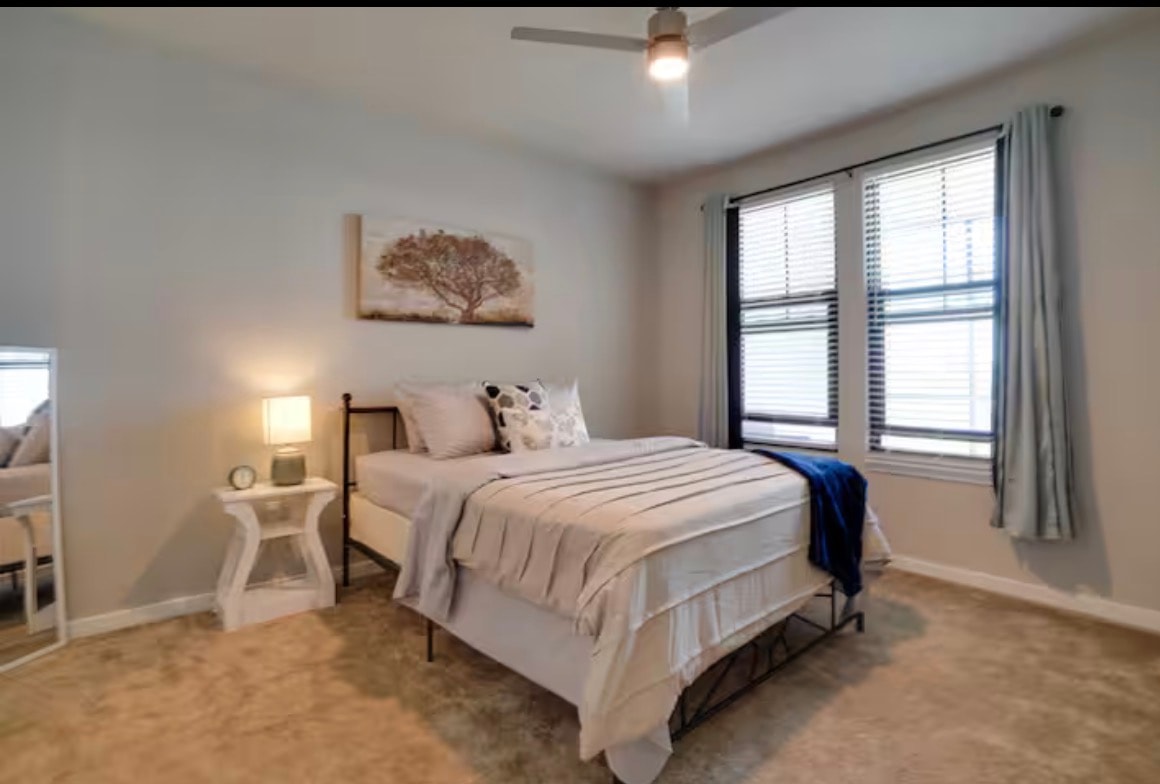 Cozy bedroom with neutral tones and warm lighting