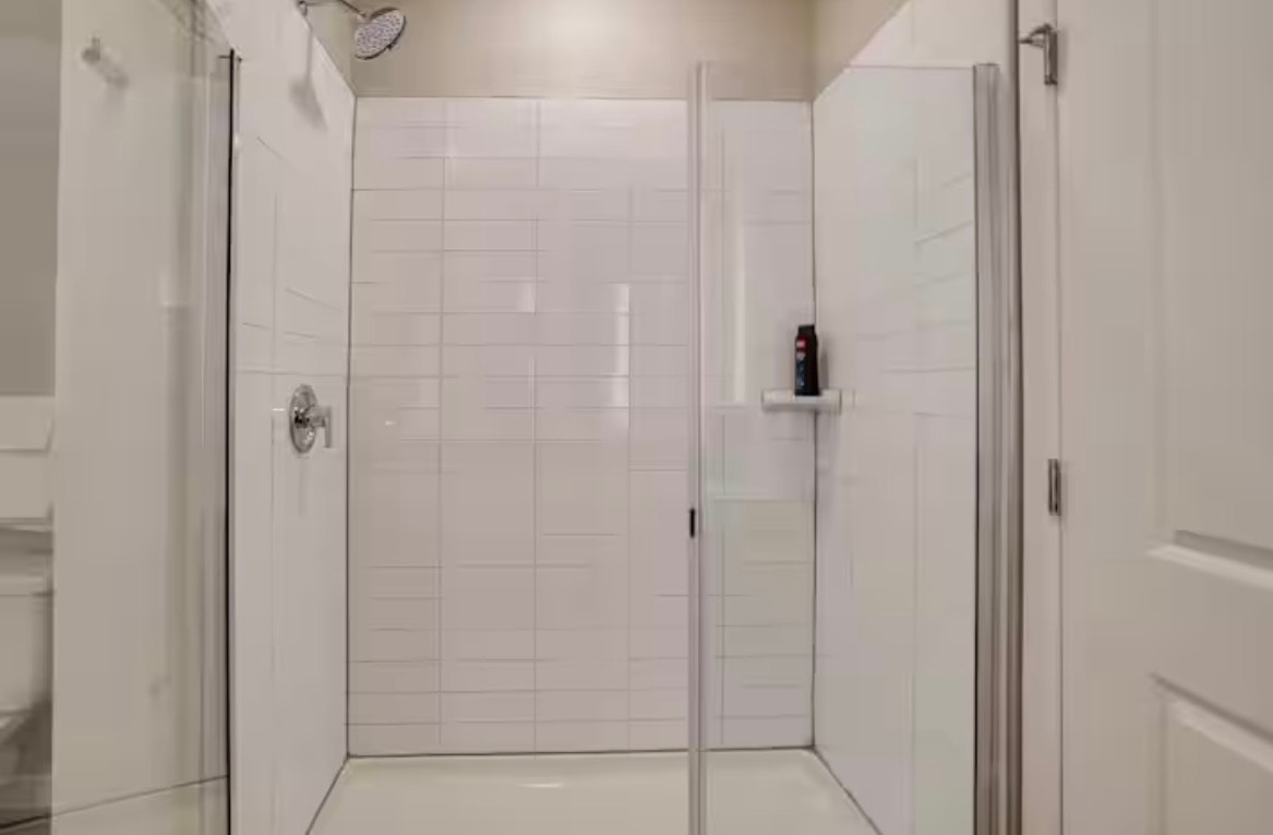 Modern bathroom shower with white subway tile