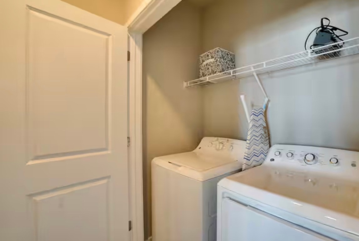 In-unit laundry room with washer and dryer